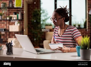 Student watching educational tutorial online on laptop, taking notes in notepad, doing homework. E learning, home education, distance university lesson, internet course classes Stock Photo - Alamy