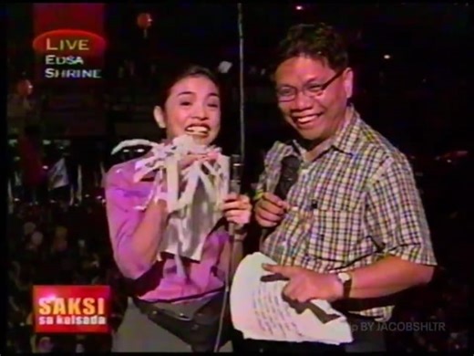 #WATCH: Saksi SPECIAL COVERAGE of the Second People Power Revolution, known as EDSA Dos. The pioneers of GMA News, Mike Enriquez and Vicky Morales, bringing you to the scene where a nation is divided, between progressives, sectorians, youth groups, Superstars, and the Filipino people all come together at EDSA Shrine in protest, calling for the resignation of then-President Joseph Ejercito Estrada. #Saksi #ImpeachmentTrial #PeoplePower2 #EDSADos #VHS #GMA7 #GMA75thAnniversary #gmanetwork #kapuso 