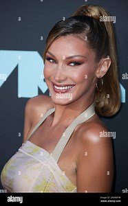 (FILE) Bella Hadid Is the World's Most Beautiful Woman According to Science. Bella Hadid is the most beautiful woman in the world according to the 'Golden Ratio' equation devised in Ancient Greece. NEWARK, NEW JERSEY, USA - AUGUST 26: Model Bella Hadid (Isabella Khair Hadid) wearing a Charlotte Knowles look, Gianvito Rossi shoes, a Jimmy Choo purse, and Chrome Hearts jewelry arrives at the 2019 MTV Video Music Awards held at the Prudential Center on August 26, 2019 in Newark, New Jersey, United 