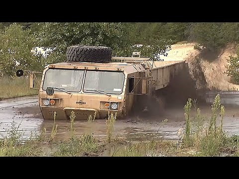 STUCK in THE MUD! How to recover a VERY EXPENSIVE military vehicle with an M984 WRECKER!