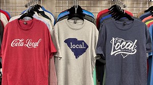Shirts remind Columbia to shop local while donating to local business