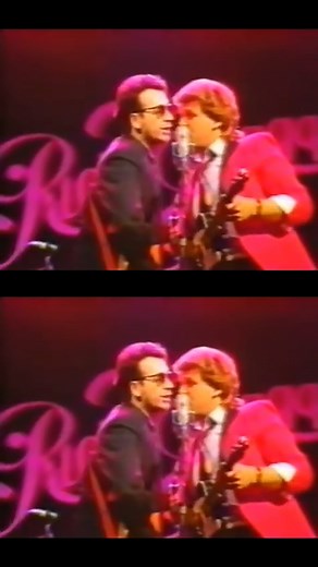 Elvis joined Ricky Skaggs on stage for a performance of “Don't Get Above Your Raising". The song can be found on Ricky’s 1985 concert album, ‘Live In London’. Listen: https://open.spotify.com/playlist/1MZINx1tS22Dodowi201qf?si=7f67163e817f43e6 | Elvis Costello