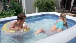 Backyard Water Fun Cute Little Kids Playing in Swimming Pool Slow...