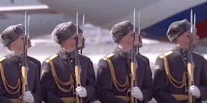 Why do Russian guards tilt their head and watch when leaders walk past?