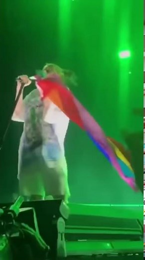 Billie Eilish performing with the pride flag