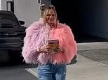 Chrissy Teigen stuns in pink feathered coat as she steps out in Los Angeles