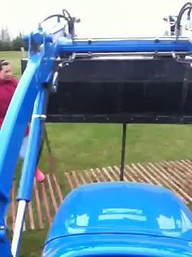 Putting in fence posts with the tractor