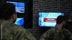warning, attack and safeness headquarters, IT war discussing battle strategy holding laptop, cyber safety on background monitor, computer on military headquarter or war base, control center
