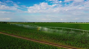 agriculture irrigation of farm field. automatic artificial irrigation of the field for good harvest. smart agriculture eco farming concept artificial intelligence
