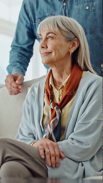Senior couple, hug and laugh on sofa with surprise, bonding and reflection in lounge at house. Elderly man, woman and embrace on couch with point, love or connection with retirement at apartment