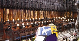 Queen sits alone as Prince Philip laid to rest in emotional service