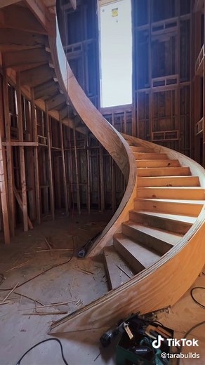 Custom Curved Floating Main Stair by HDZ Construction