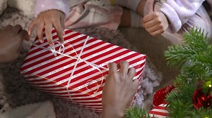 Top View of Child Unwrapping Present | Free Stock Video Footage