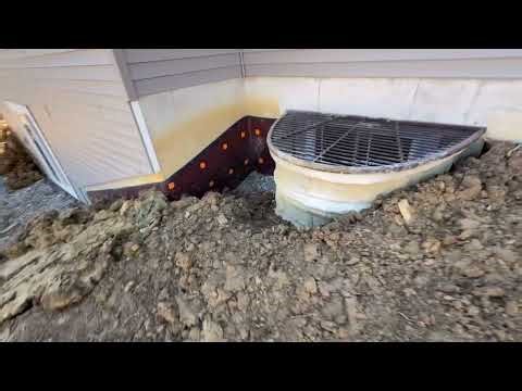 Hanging a new window well and backfilling around a house
