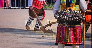 Bulgarian Kukers with bells and traditional costumes, masked people kukeri dancing in masquerade festival Kukerlandia, Yambol, Bulgaria