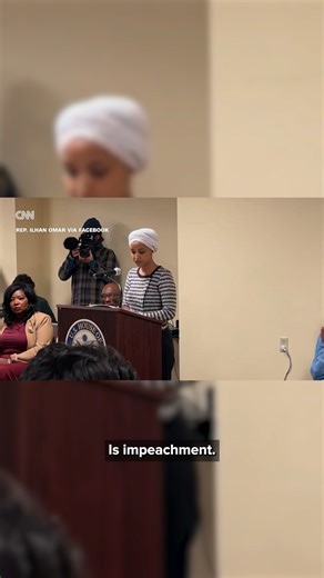 A man in a black jacket was tackled to the ground and escorted out of the building by security after spraying an unknown substance on U.S. Rep. Ilhan Omar at a town hall she was hosting in Minneapolis on Tuesday. "Here's the reality that people like this ugly man don't understand; we are Minnesota strong, and we will stay resilient in the face of whatever they might throw at us," Omar said after the man was escorted away. The audience cheered as he was pinned down and his arms were tied behind h