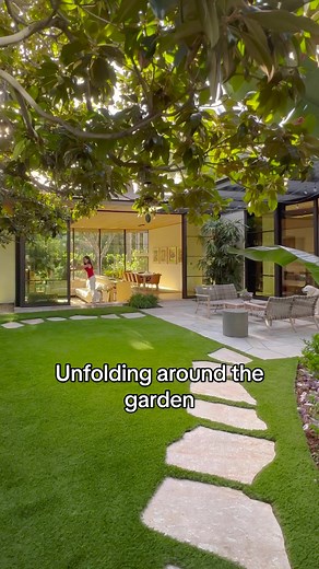 Unfolding around the garden, Palms Residence by Olson Kundig has been designed to evoke a deep connection to nature and the surrounds of Venice Beach. Wanting the home to connect with the garden, the architect has blurred the lines between it and the living and dining areas, bedrooms and yoga studio to heighten the idea of outdoor and indoor living. Further emphasising this, Olson Kundig has employed materials such as glass and metal as well as white stucco walls and dark colours to enhance the