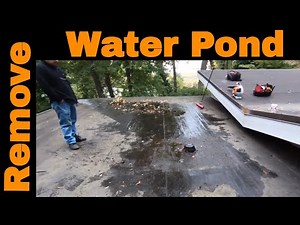 Remove ponding water off a flat roof - replace your roof drain with a channel and a scupper