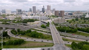 Atlanta, Georgia skyline and freeway traffic with drone video wide shot stable.