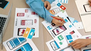 Top view panorama video of startup company employee planning on user interface prototype for mobile application or website in office. UX UI designer brainstorm user friendly interface plan. Synergic