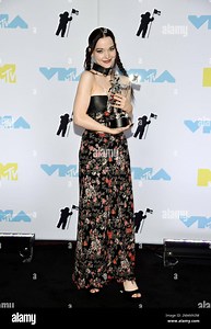 Dove Cameron poses in the press room with her award for best new artist at the MTV Video Music Awards at the Prudential Center on Sunday, Aug. 28, 2022, in Newark, N.J. (Photo by Evan Agostini/Invision/AP Stock Photo - Alamy