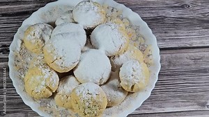 Traditional Arabic cookies for celebration of Islamic holidays of El-Fitr feast, Egyptian Kahk usually covered with powdered icing sugar and stuffed with nuts, hazelnuts, ajamiya, walnuts and Malban