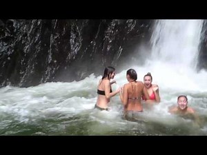 swimming under a waterfall