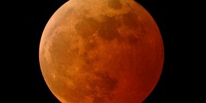 Why does the moon turn red during a lunar eclipse?