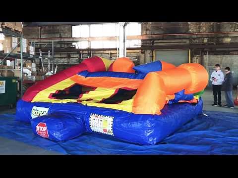Inflating the Bounce Zone Castle Bouncy House for a customer