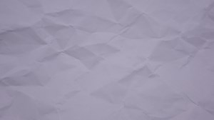 Download Crumpled wrinkled sheet of paper background texture. Stop motion animation. Seamless looping. for free