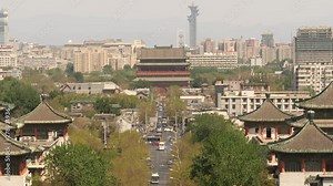 High angle view of Beijing, China, with busy road and old and new buildings.