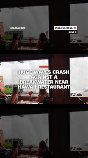 Huge waves crash against a breakwater near Hawaii restaurant