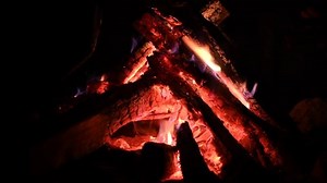 clip-1091420381-bonfire-night-logs-burning-sparks-flying-fire