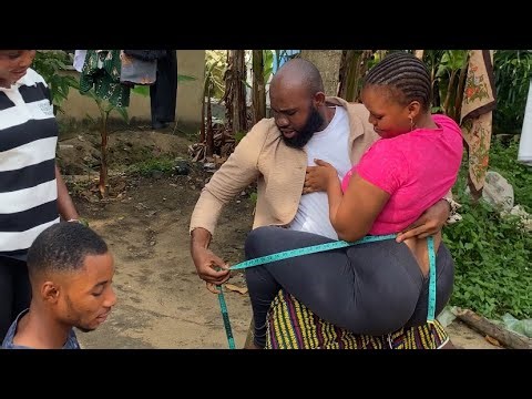 Tailor taking a serious measurement