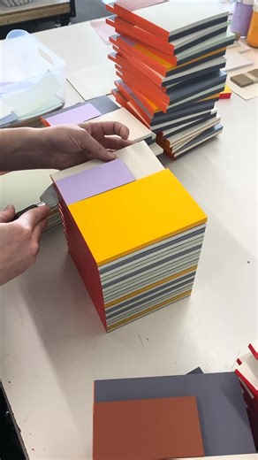 Moglea on Instagram: "Here’s the team working on our Surprise Section Pads, which utilize the scrap sheets from many of our different notepad styles or projects. A bit of upcycling in our world. These are the perfect artful desk accessories, which combine three different-sized pads, making a pleasing little composition. Don’t forget that our Seconds are still 10% off online too! 落"