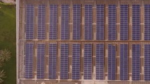 clip-3660006127-aerial-shot-solar-panels-on-building-roof