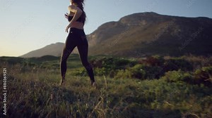 Woman running barefoot on the sand