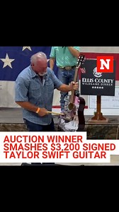 A man in Austin, Texas, smashed a signed Taylor Swift guitar after winning it at auction for $3,200 on Saturday. | Newsweek