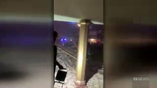 Aftermath of theatre roof collapse in Illinois after tornado hit during concert