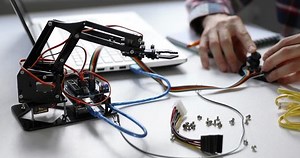 clip-1019467084-robotics-engineer-programming-robot-arm-automation-project