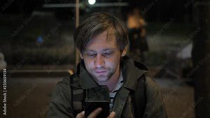 Man voice recognition with smart phone in park night hotel outdoor, student male use message audio helper finder bus stop subway metro station Stock Video