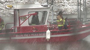 Sailboat stranded on river during snowstorm