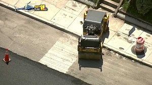 Construction worker struck by asphalt roller in Hampden dies