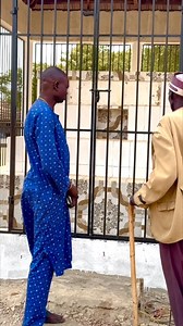 At my father’s graveyard with Uncle Marial Luny Dharuai — my late father Sultan Maker Riak’s best friend. Uncle Marial brought me here and, in a touching moment, confirmed to my father that I will officially carry his walking iron (Leec) as he (father) revealed to a cousin, Madit Guol Riak in a dream! | HocThon Laat Maker Riak