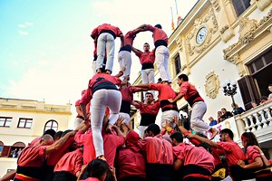 A "castell" is a tower of humans climbing up upon one another