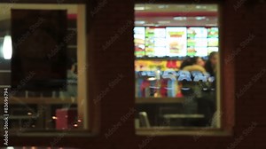 Windows of a fast food restaurant in the evening