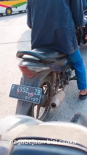 Close-Up Motorcycle Scene: Adjustments and Actions