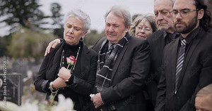 Death, funeral and elderly couple sad together in pain or grief for death and loss during a ceremony. Rose, support or empathy with a senior man and woman feeling depression at a memorial service
