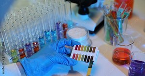 Scientist uses color palette comparing patterns on paper