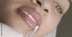 Anesthesia applied to the lip with ointment. Realization of lip pigmentation, aesthetic procedure for the lips.